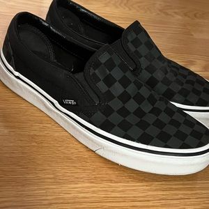 Black and grey checkered slip on vans